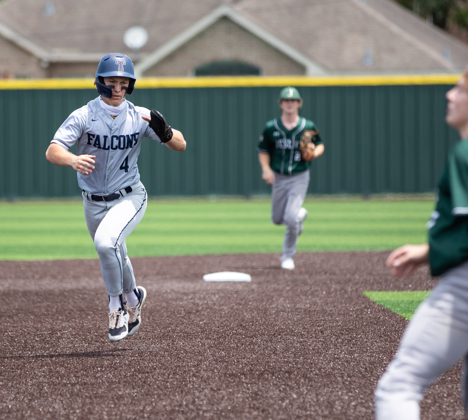 Tompkins senior Will Stark rounds past second base during the first inning of Game 3 of the Falcons’ Region III-6A semifinals against Strake Jesuit on Saturday, May 29, at Cy-Falls High. Stark eventually scored on an RBI groundout by Jace Laviolette.